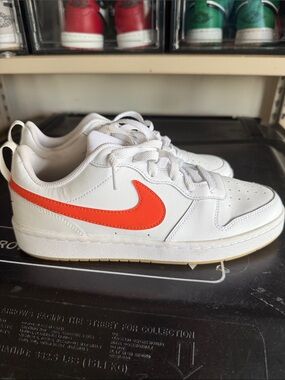 Nike Kids White Sneakers with Bright Orange Swoosh
